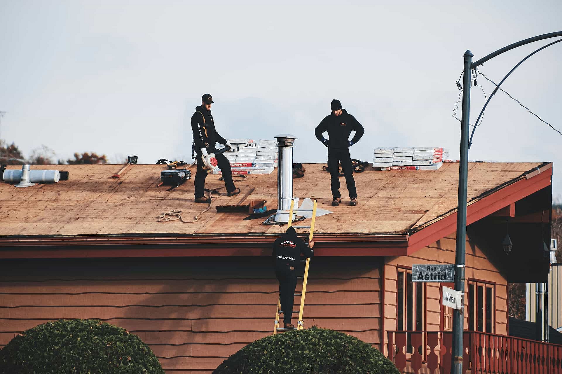 Roofing contractor working on a residential roof